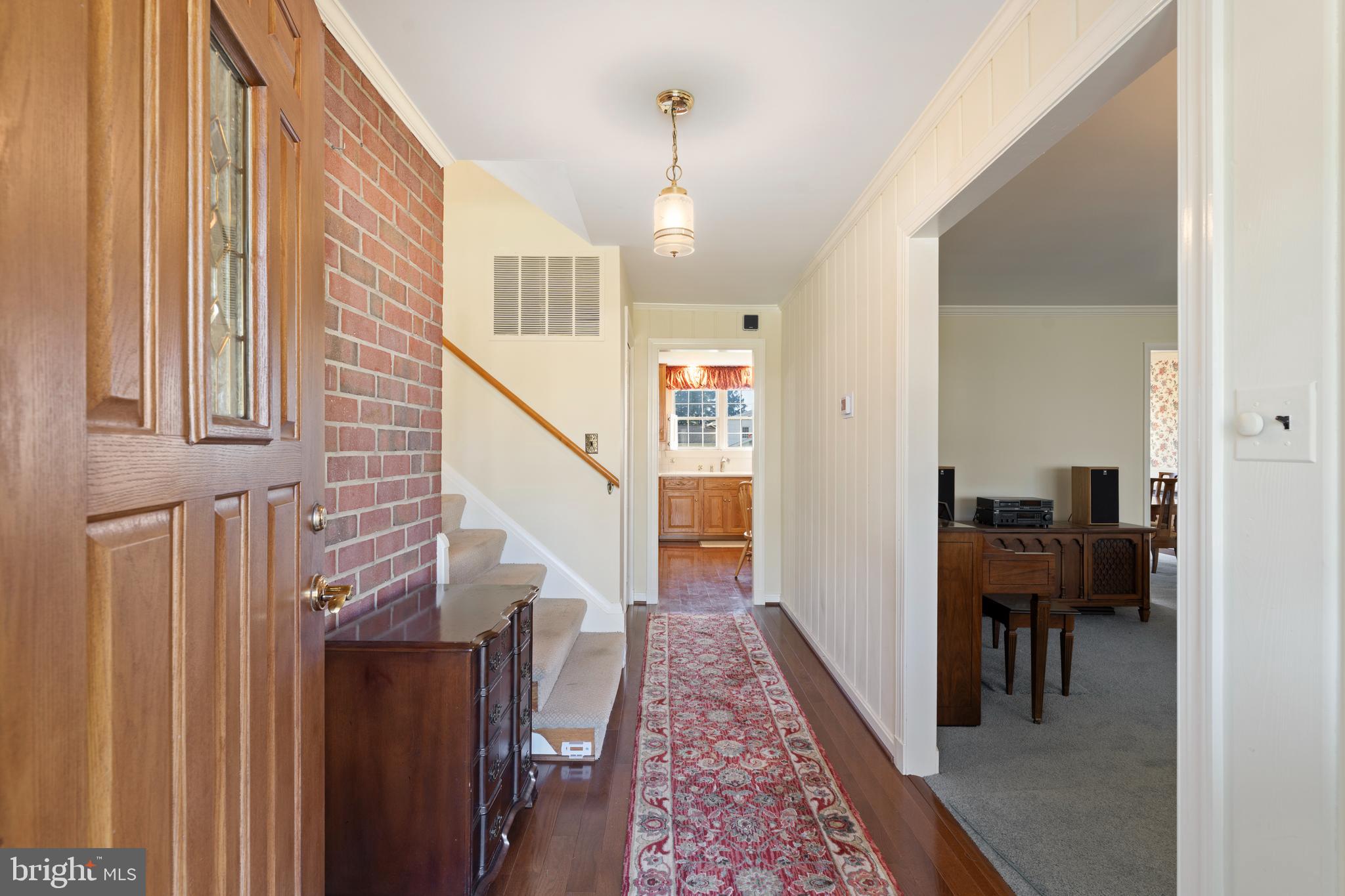 119 East Padonia Road Lutherville-Timonium, MD 21093 - Photo 5 of 39 a view of a hallway with wooden floor and entryway