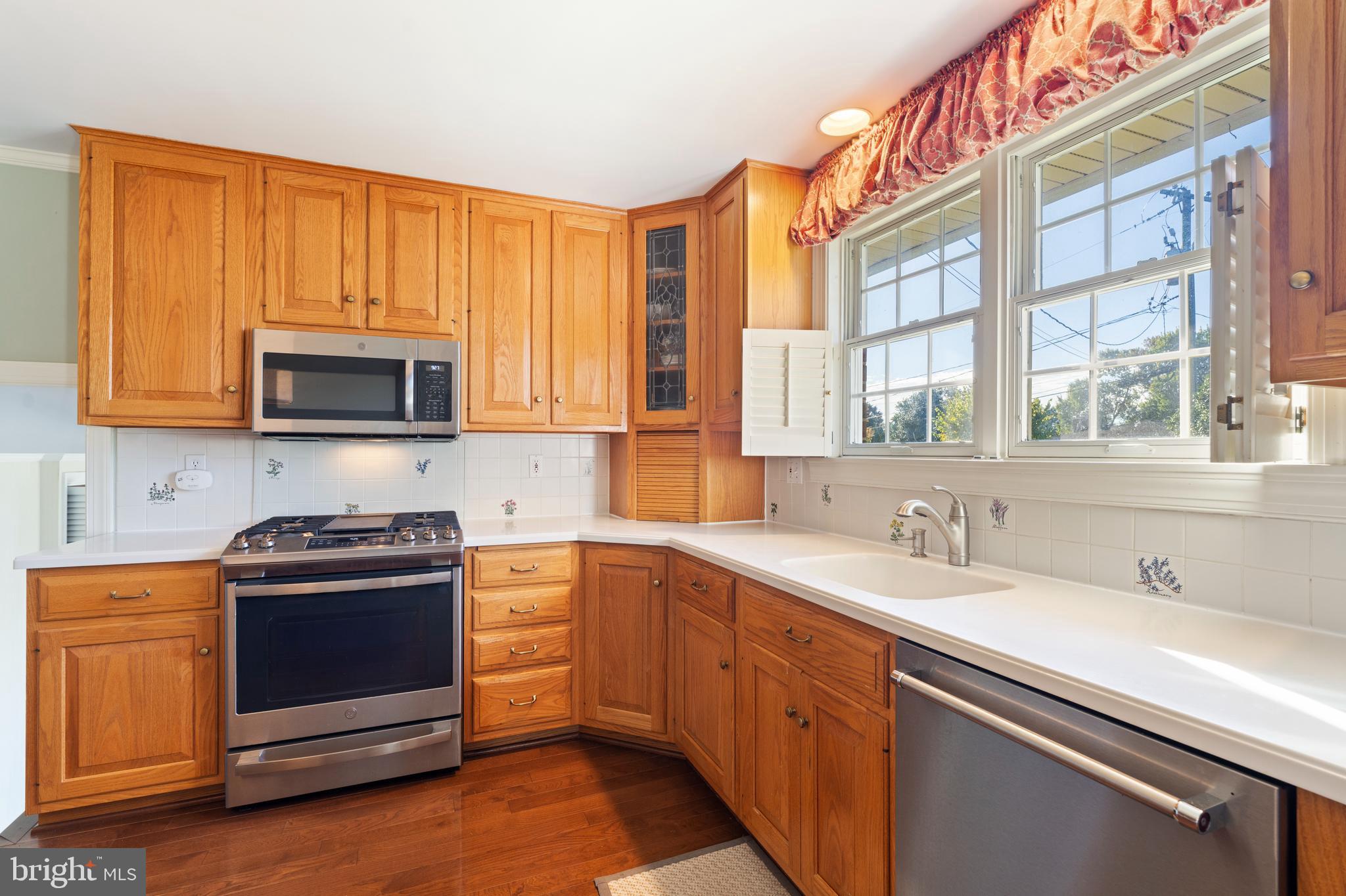 119 East Padonia Road Lutherville-Timonium, MD 21093 - Photo 10 of 39 a kitchen with stainless steel appliances granite countertop a sink and a stove