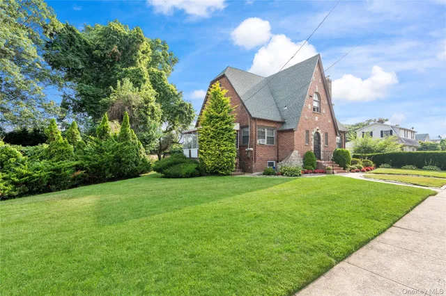a view of a garden with a house