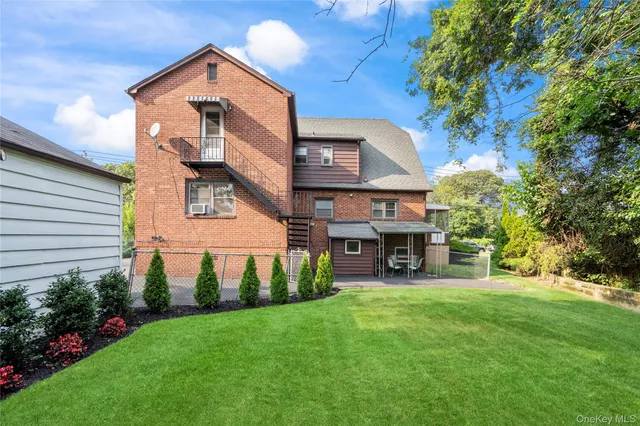 a view of a house with a yard porch and sitting area