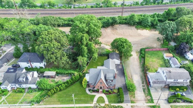 an aerial view of residential house with outdoor space and lake view