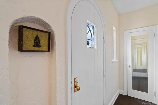 a painting on a wall next to a window