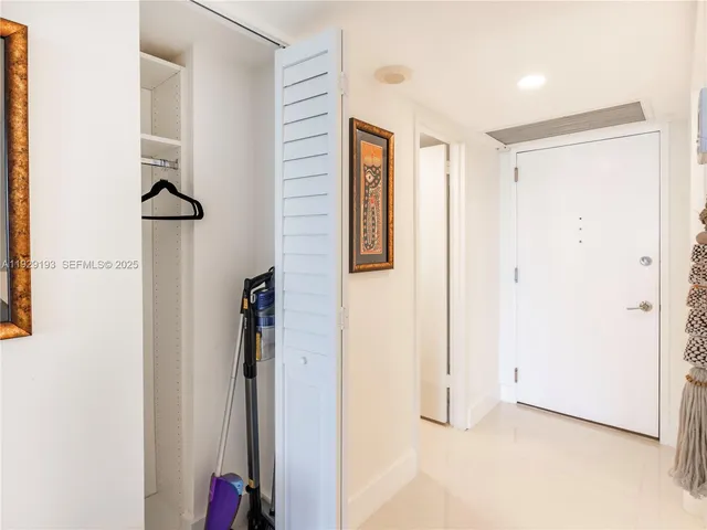 a view of a living room and kitchen with a large window
