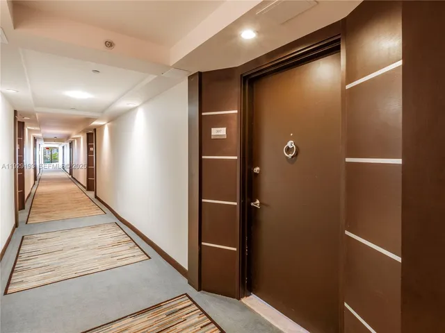 a view of a swimming pool with a yard