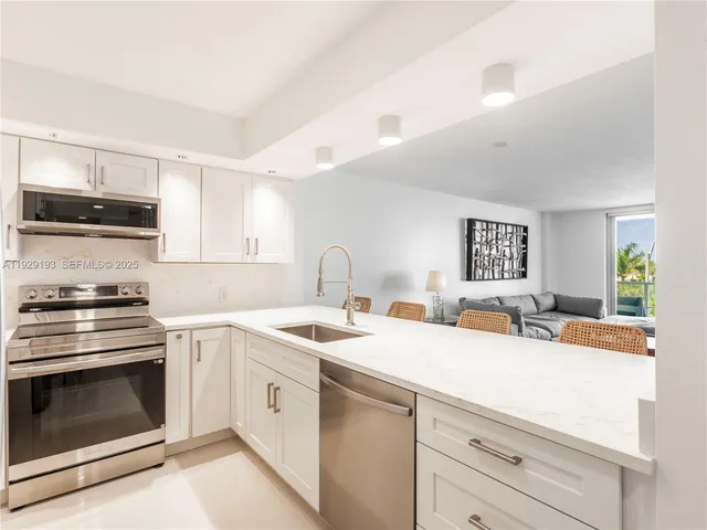 a kitchen with a stove and a sink
