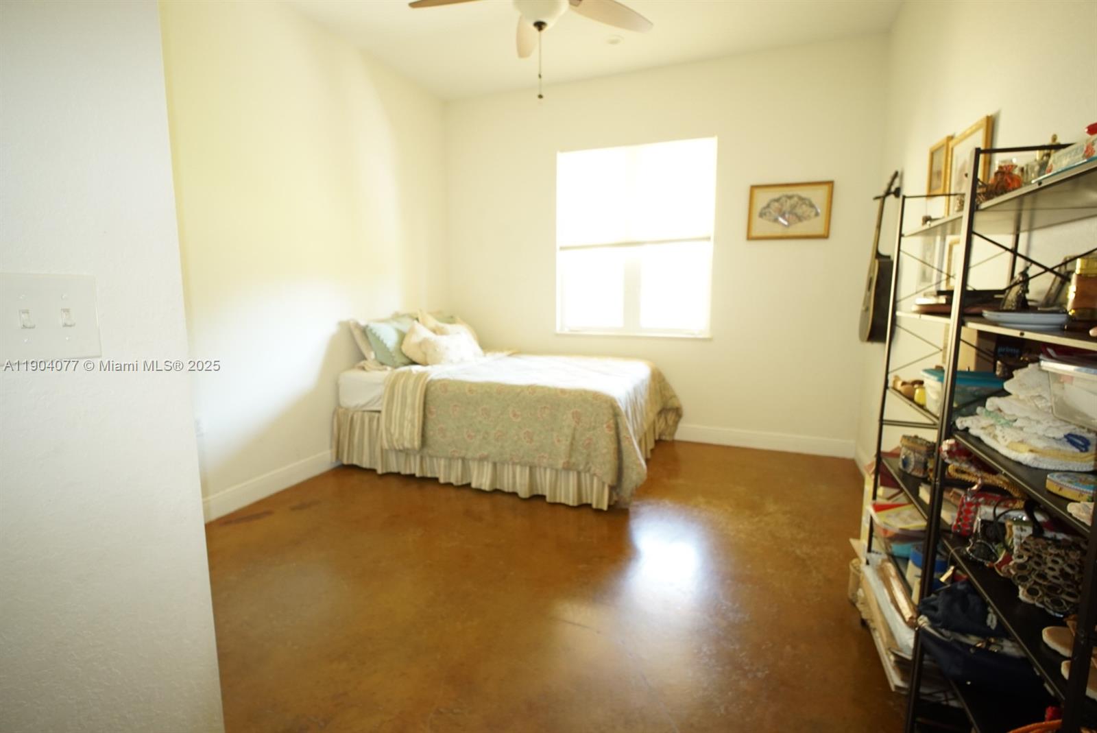 2184 9 Mile Road LaBelle, FL 33935 - Photo 13 of 41 a bedroom with a bed and wooden floor