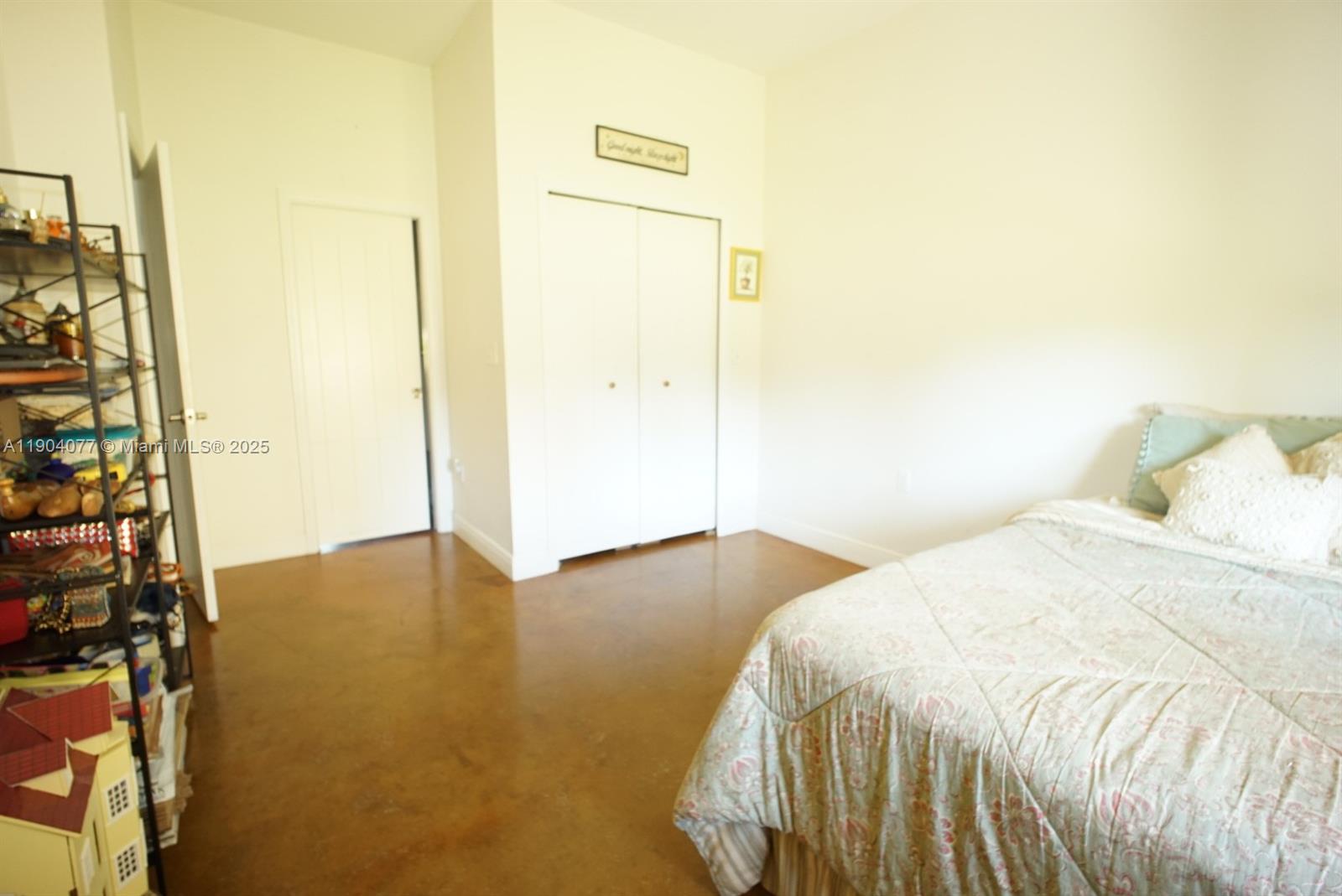 2184 9 Mile Road LaBelle, FL 33935 - Photo 14 of 41 a bedroom with a bed and wooden floor