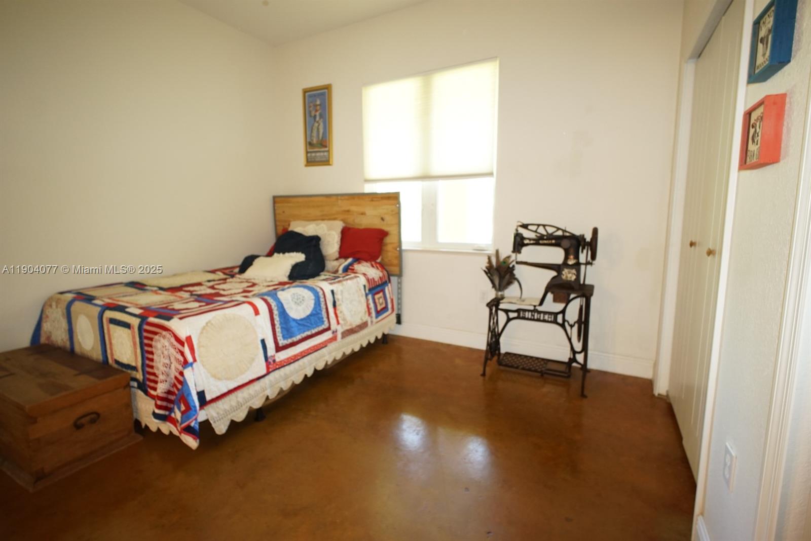 2184 9 Mile Road LaBelle, FL 33935 - Photo 15 of 41 a bedroom with a bed and a window