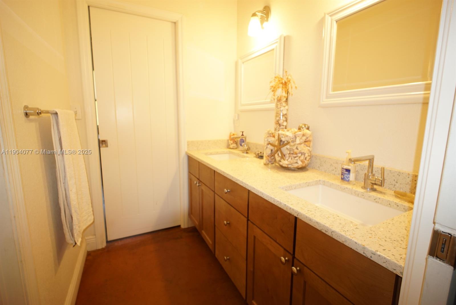 2184 9 Mile Road LaBelle, FL 33935 - Photo 16 of 41 a bathroom with a double vanity sink and a mirror