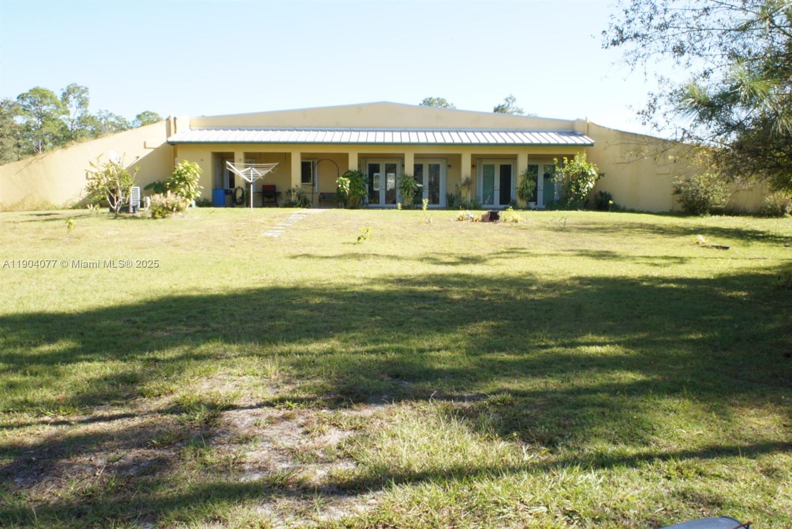2184 9 Mile Road LaBelle, FL 33935 - Photo 18 of 41 a view of swimming pool with outdoor seating