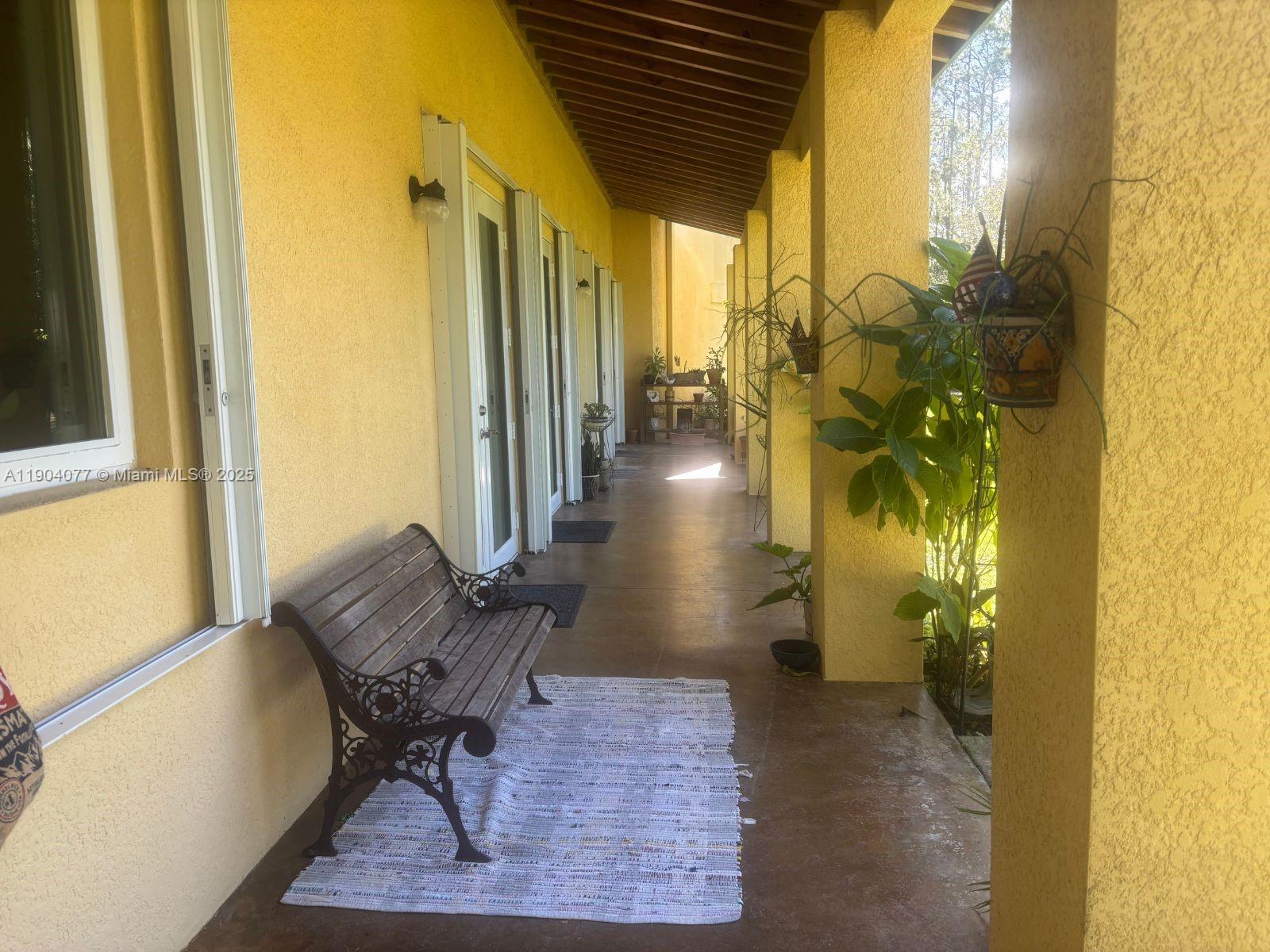 2184 9 Mile Road LaBelle, FL 33935 - Photo 19 of 41 a view of a hallway with seating area