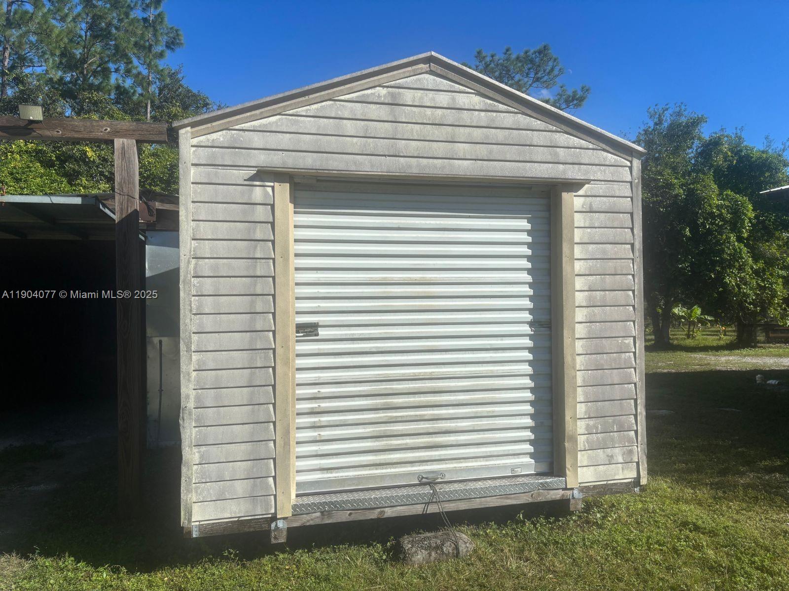 2184 9 Mile Road LaBelle, FL 33935 - Photo 28 of 41 a view of a house with a yard