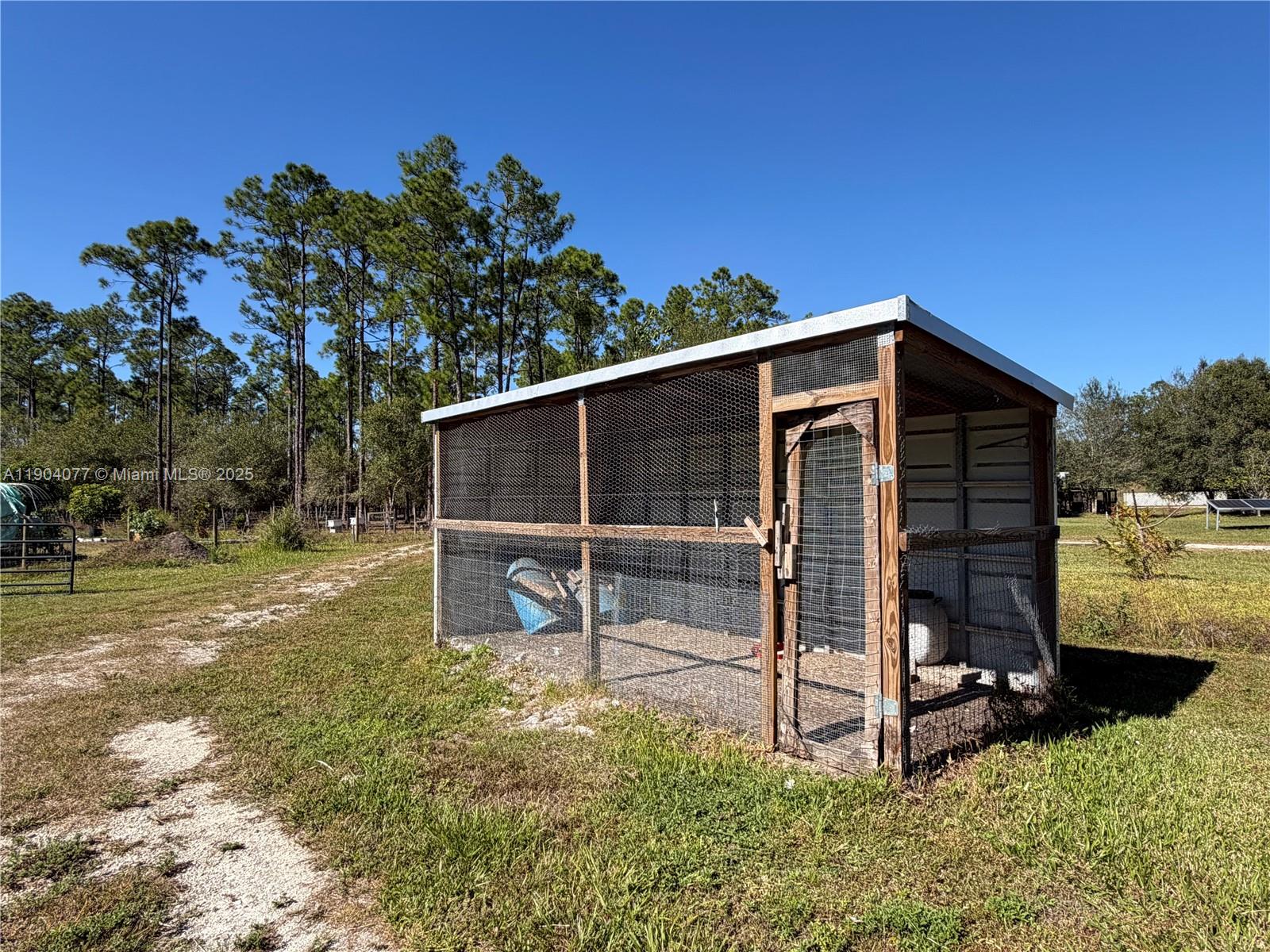 2184 9 Mile Road LaBelle, FL 33935 - Photo 30 of 41 a view of a house with backyard