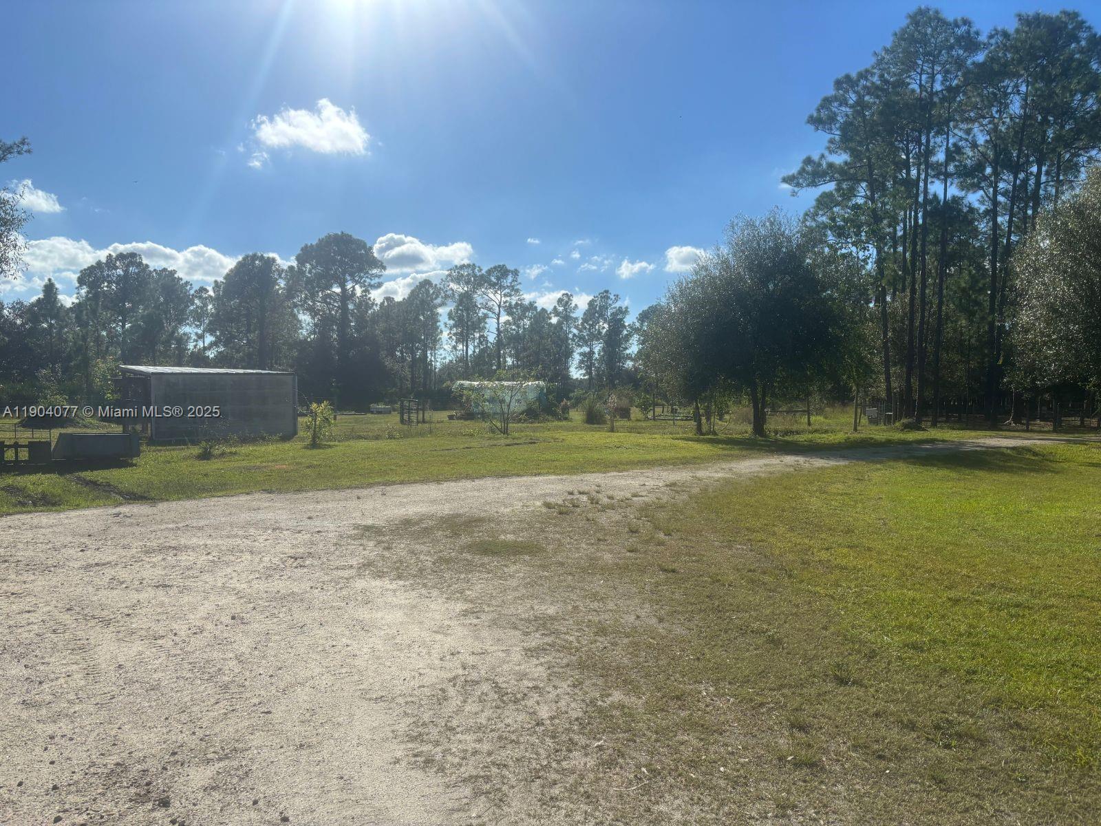 2184 9 Mile Road LaBelle, FL 33935 - Photo 33 of 41 a view of a golf course with a lake