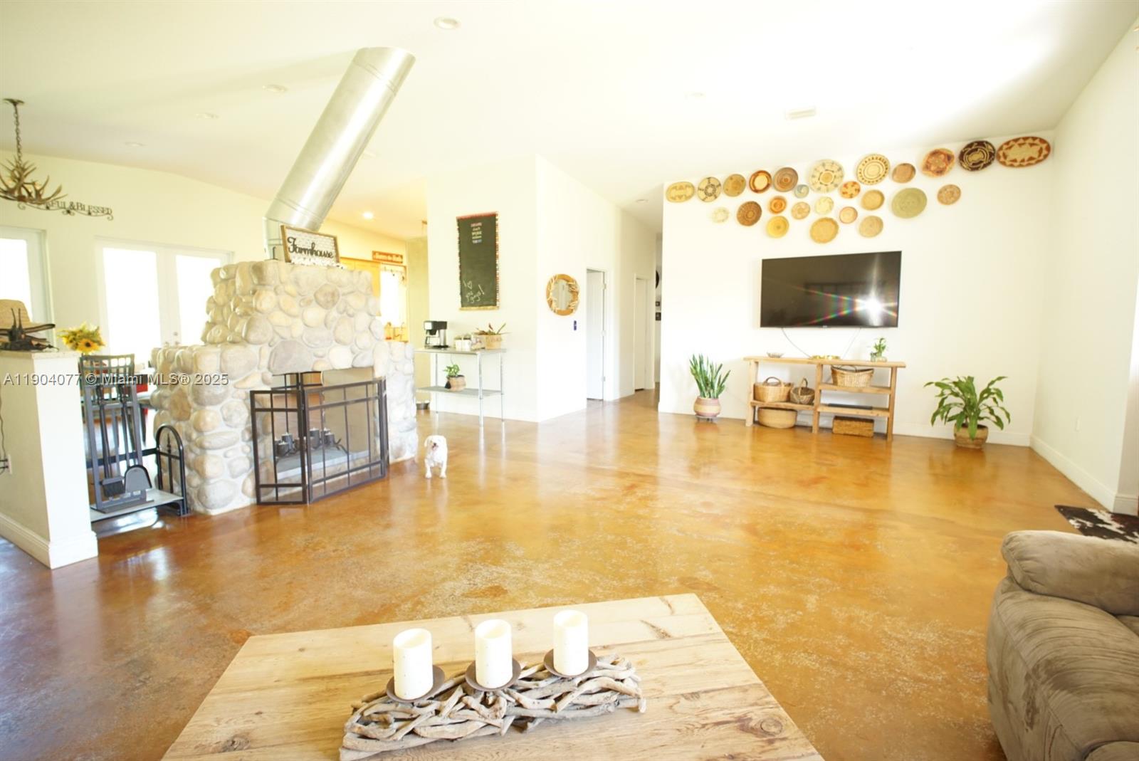 2184 9 Mile Road LaBelle, FL 33935 - Photo 6 of 41 a living room with couches and pool view with wooden floor