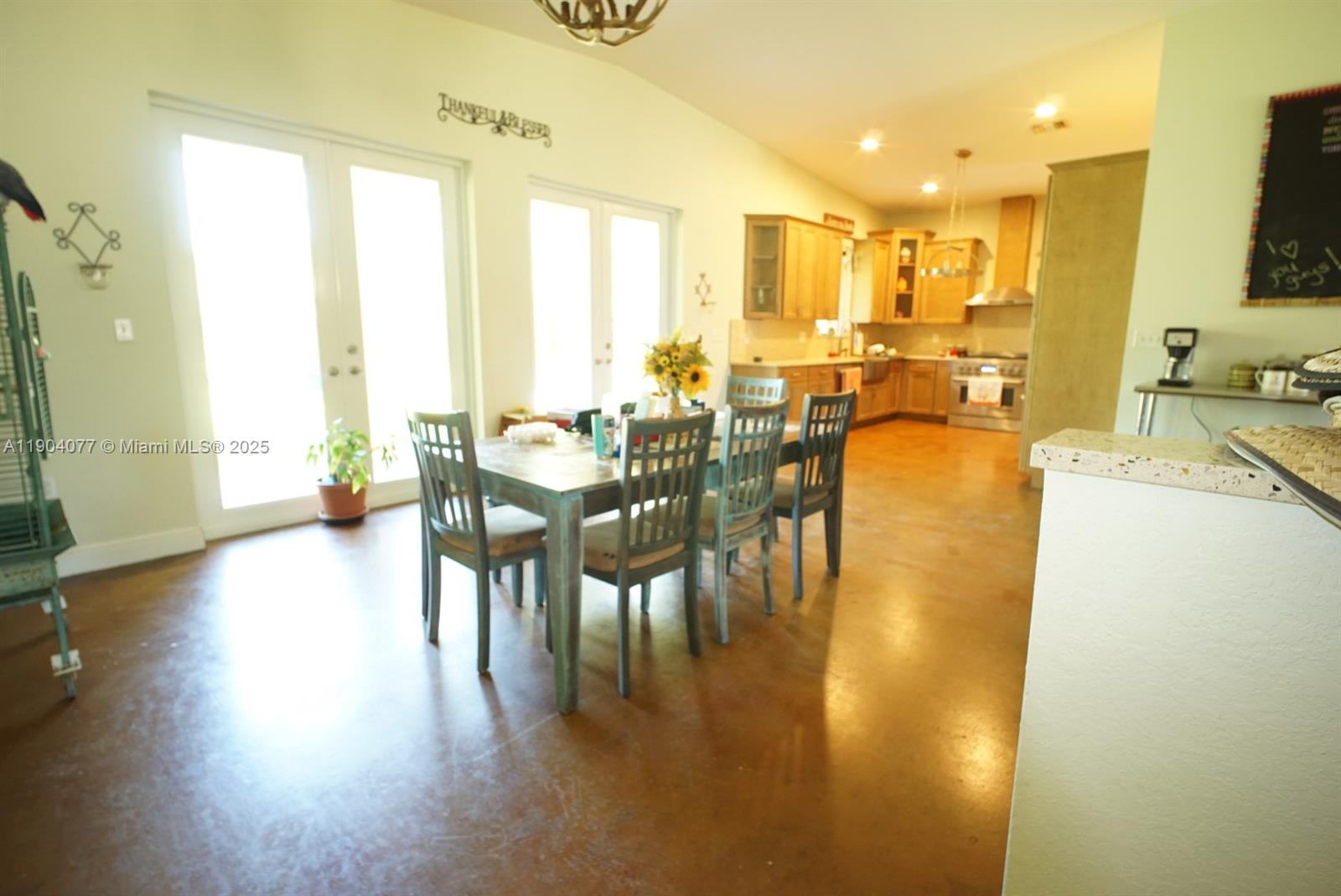 2184 9 Mile Road LaBelle, FL 33935 - Photo 9 of 41 a view of a dining room with furniture and wooden floor