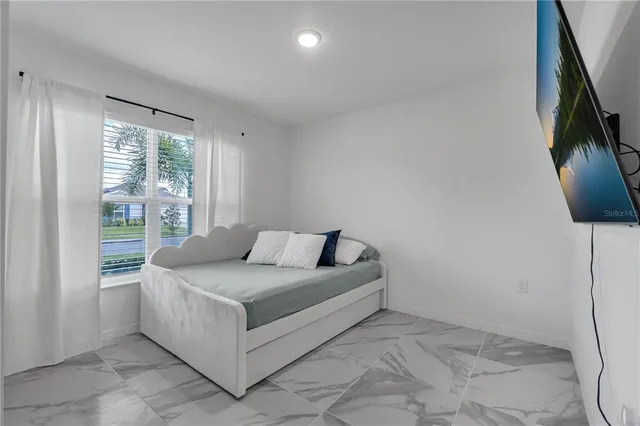 a room with a bed and a chair