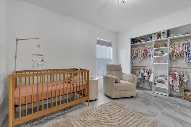 a living room with furniture a rug and a window