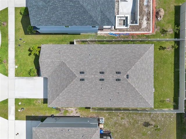 a view of a swimming pool with a yard
