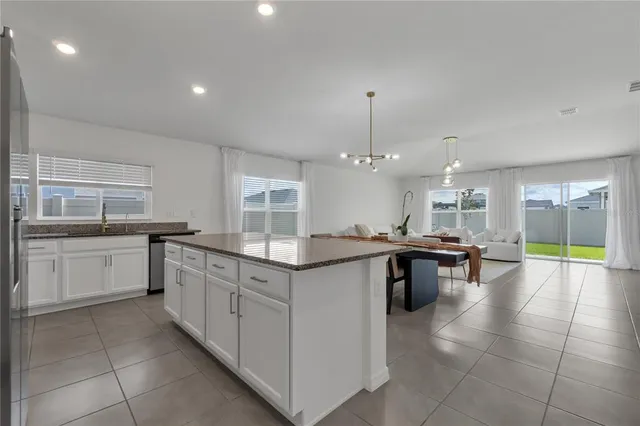 a kitchen with a sink and counter top