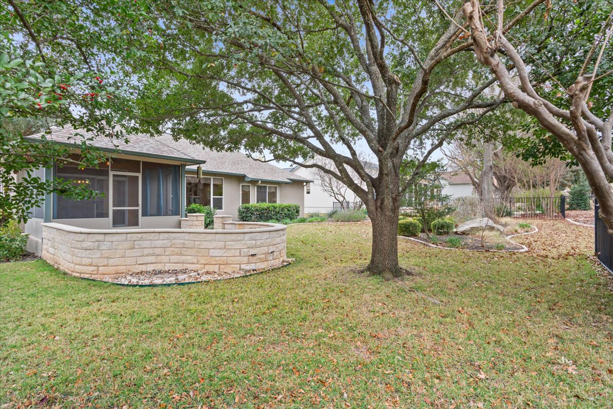 246 Red Poppy Trail Georgetown, TX 78633 - Photo 30 of 32 a view of a house with a yard