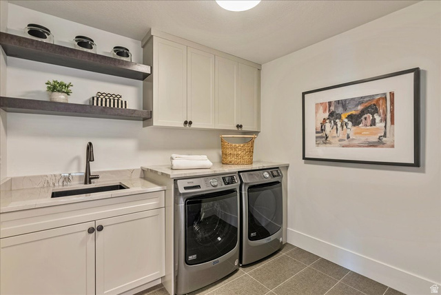 2458 West Aurora Avenue, Unit 287 Mapleton, UT 84664 - Photo 18 of 24 Laundry area with light tile patterned floors, cabinet space, and washing machine and dryer