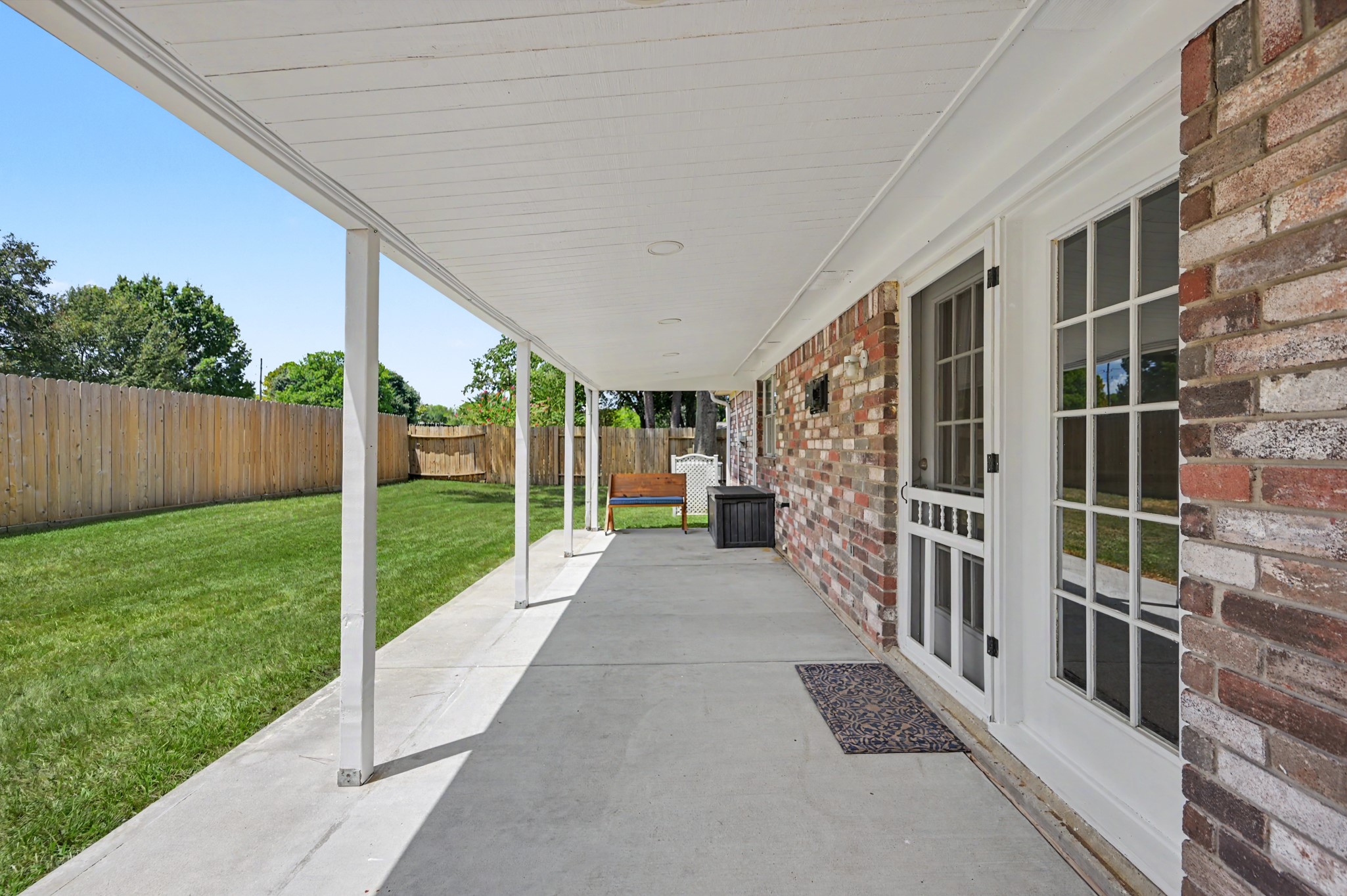 17019 Fordingbridge Court Spring, TX 77379 - Photo 22 of 26 A generous covered patio stretches across the rear of the home, providing a comfortable shaded space for relaxing, dining, or gathering with family and friends.