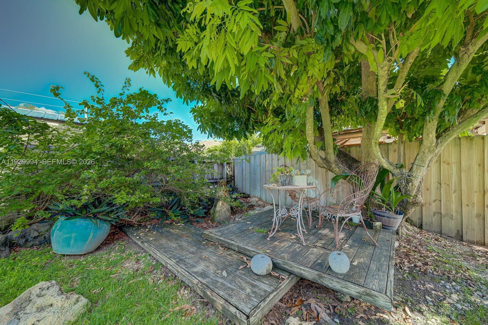 18128 Southwest 151st Avenue Miami, FL 33187 - Photo 38 of 40 a view of a backyard with sitting area