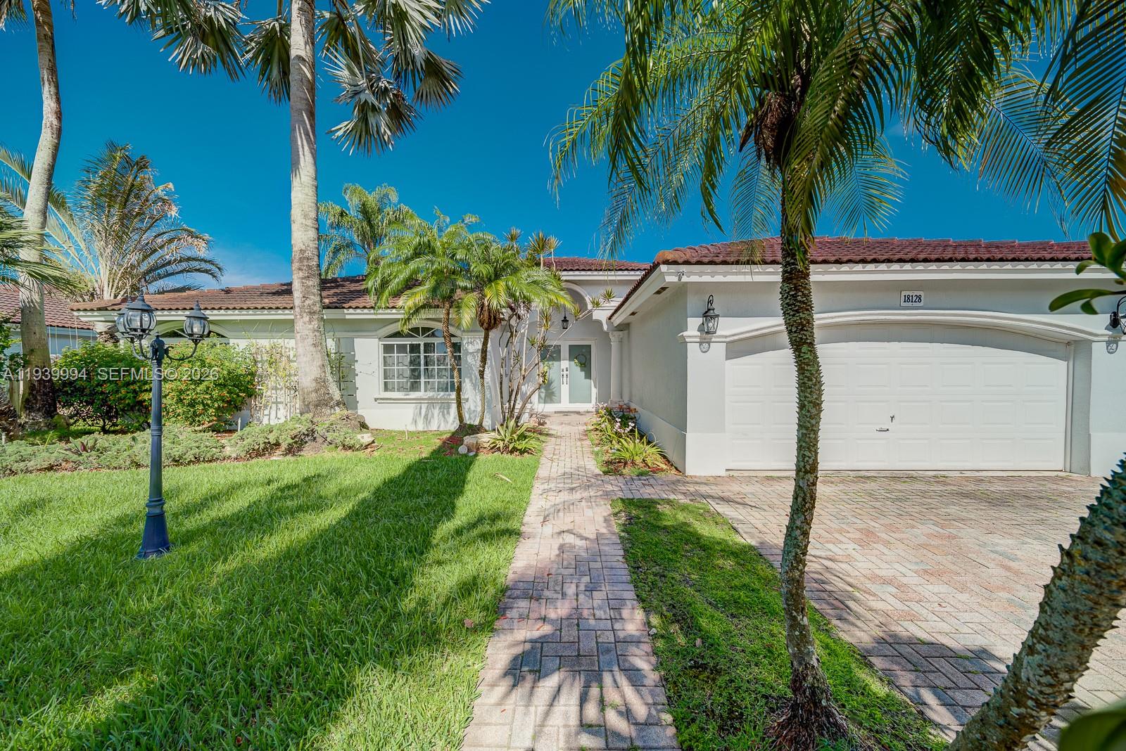 18128 Southwest 151st Avenue Miami, FL 33187 - Photo 5 of 40 a view of a yard with palm trees