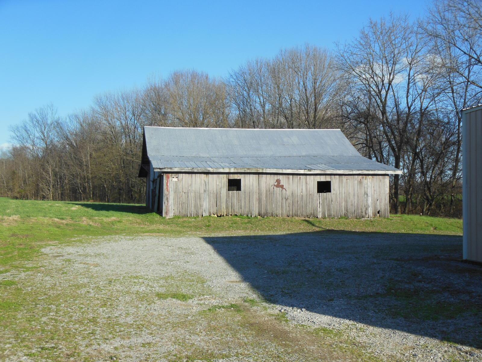 5025 Boyd Holland Road Springfield, TN 37172 - Photo 20 of 30 a view of a house with a yard and trees