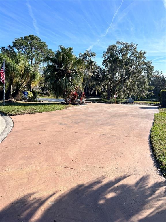 722 Landry Lane Tavares, FL 32778 - Photo 12 of 17 a view of an outdoor space and tennis court