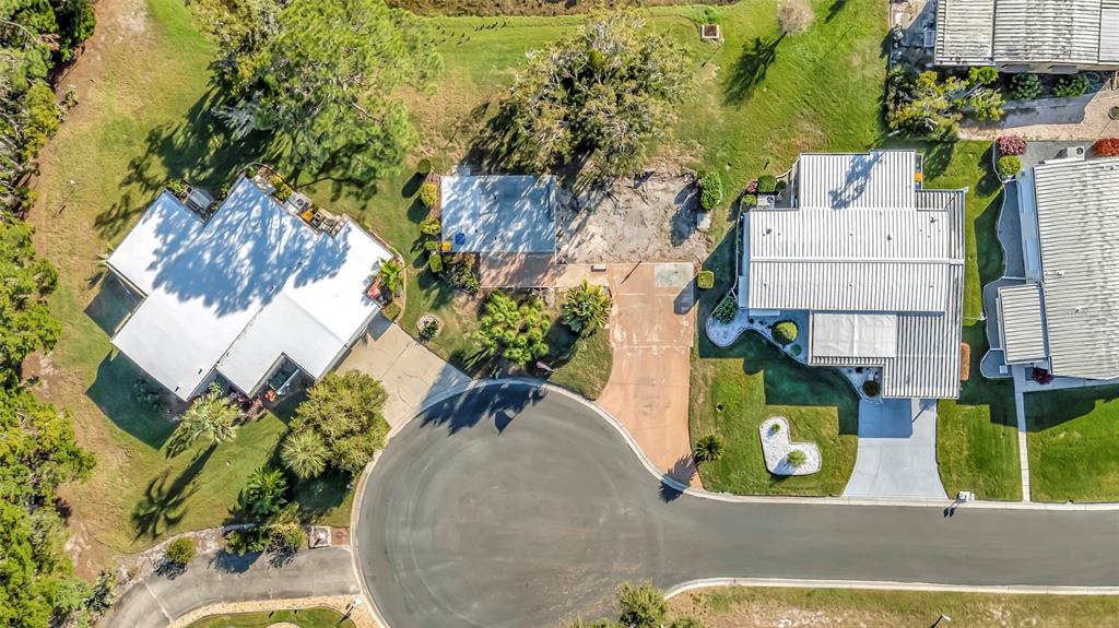 722 Landry Lane Tavares, FL 32778 - Photo 15 of 17 an aerial view of a house with a yard and large trees