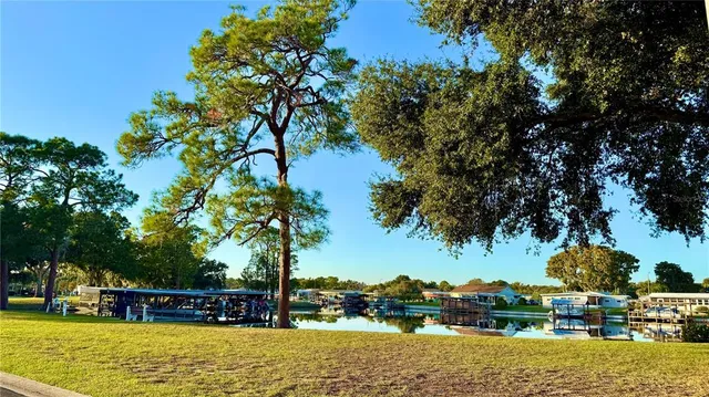 a view of swimming pool with outdoor seating and a garden