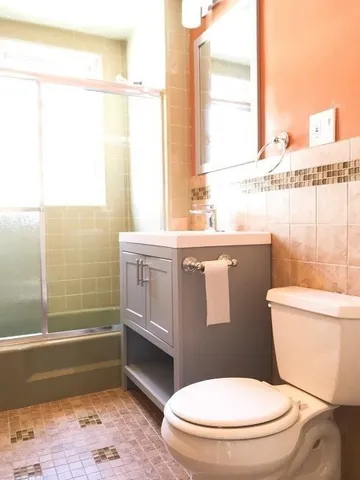 a bathroom with a toilet a sink and a bathtub