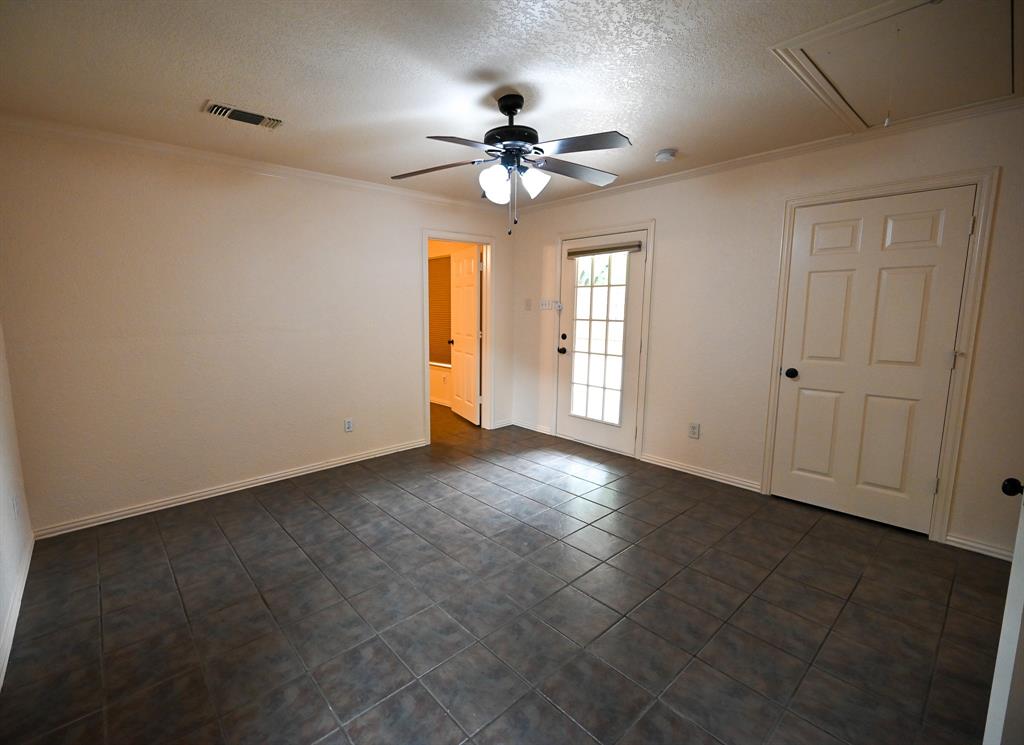3201 South Garland Street Decatur, TX 76234 - Photo 11 of 20 a view of a livingroom with a ceiling fan and window