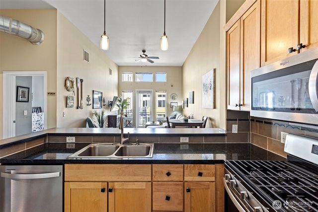 a view of a workspace with furniture and wooden floor