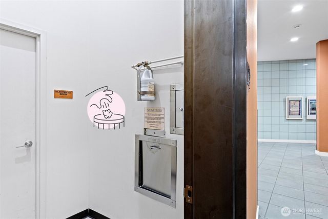 a view of a hallway with a white house and a car parked