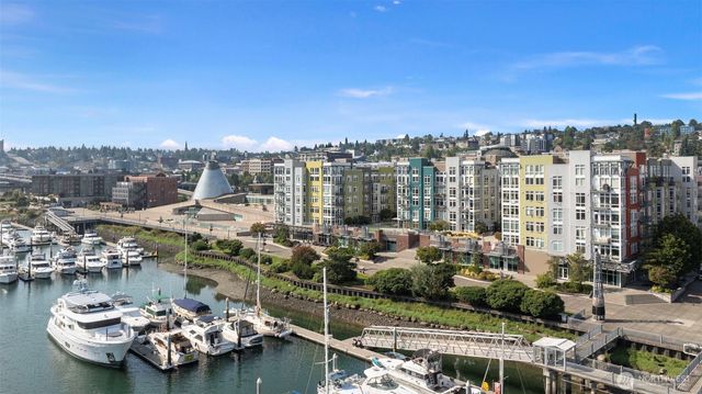 a view of a lake with tall building