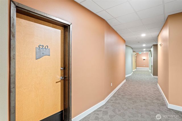 a living room with furniture flat screen tv and couches