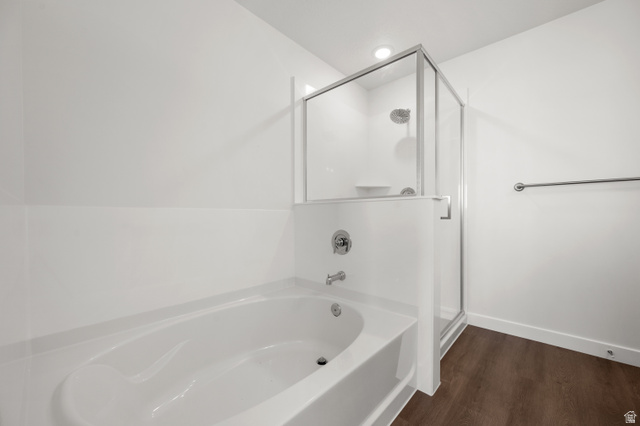 1554 Pheasant Road Eagle Mountain, UT 84005 - Photo 18 of 29 Full bathroom featuring a bath, a shower stall, and dark wood-type flooring