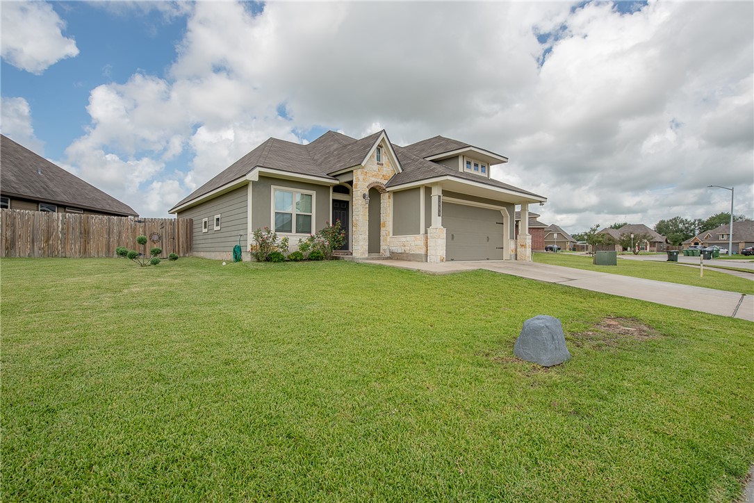 a front view of a house with yard