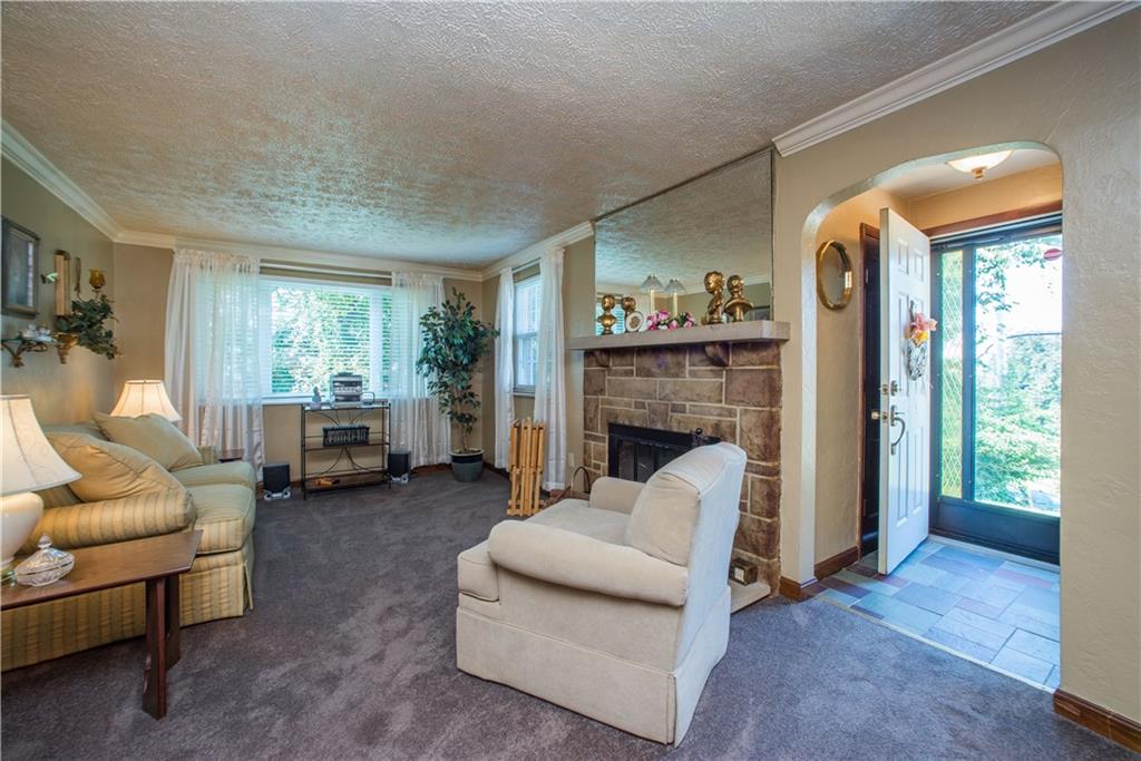 740 Agnew Road Pittsburgh, PA 15227 - Photo 6 of 25 Plenty of space in the living room with gas log fireplace.