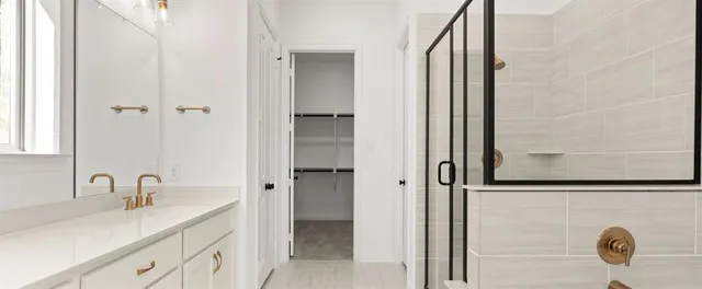 a bathroom with a sink and mirror