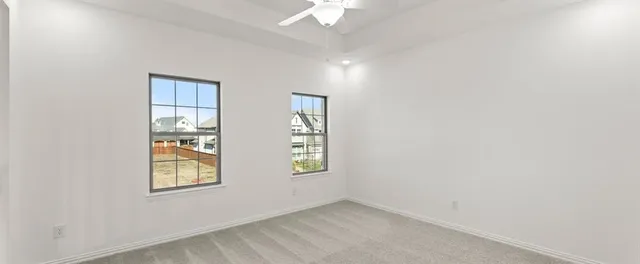 an empty room that has a window in it
