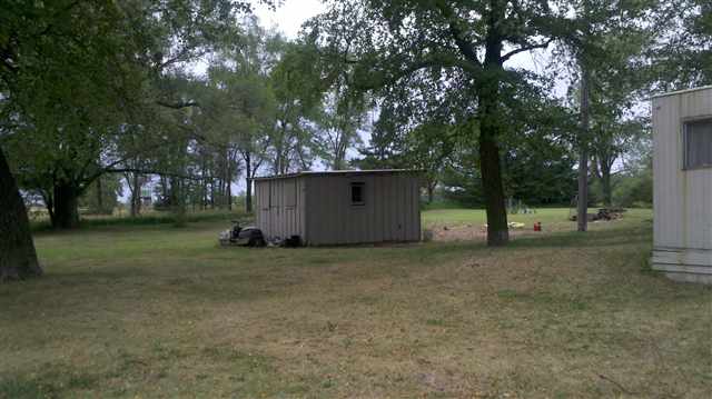 7369-7379 Riverview Road Thomson, IL 61285 - Photo 2 of 5 a view of a house with a tree