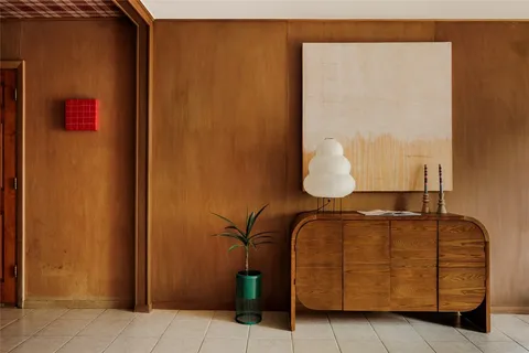 a room with a couch and dresser