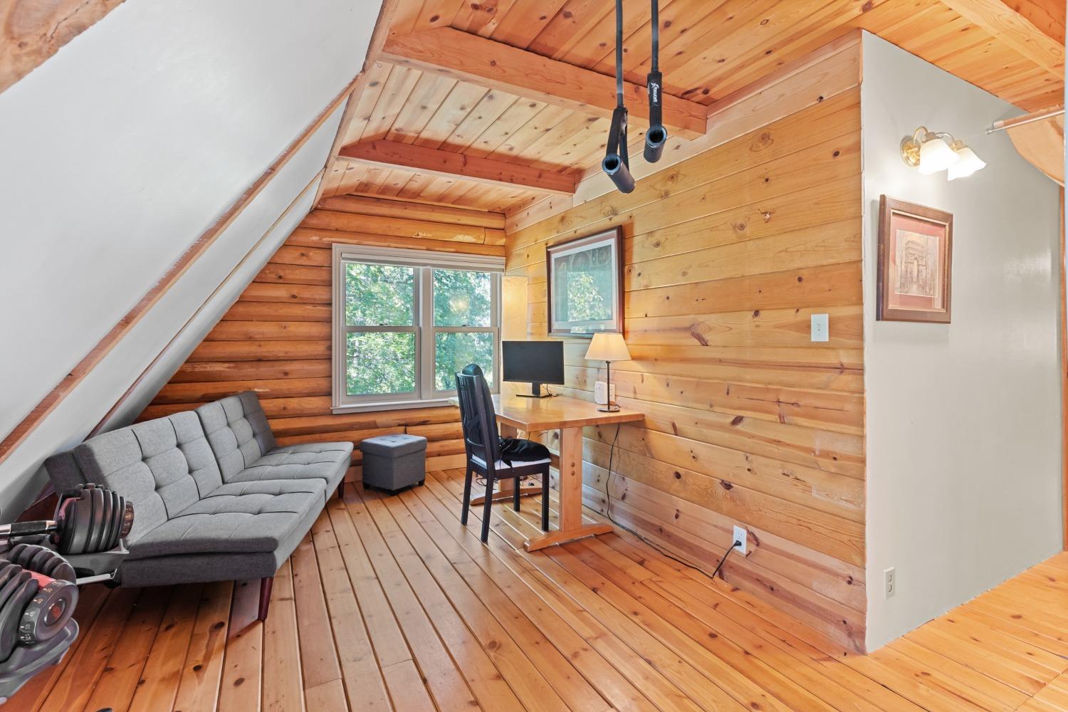 15250 Mitchell Mine Road Pine Grove, CA 95665 - Photo 38 of 50 a view of a deck with couches chairs and wooden floor