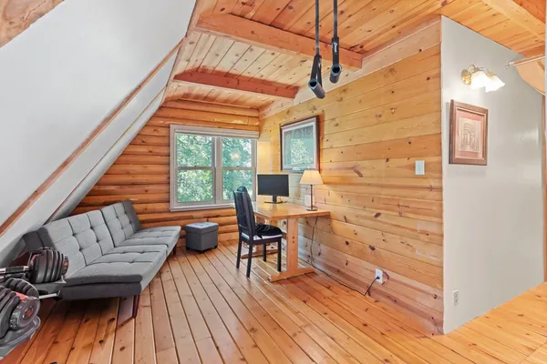 a view of a balcony with wooden floor