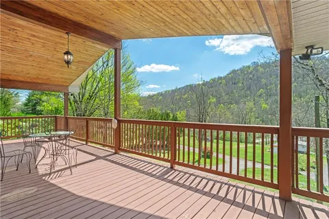 a outdoor view of a building with a tub and porch