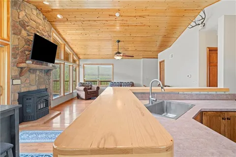 a kitchen with a refrigerator a stove a sink and a cabinets